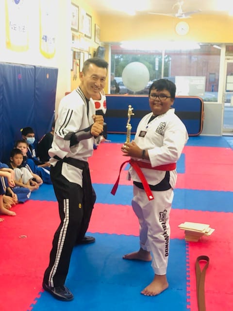 Receiving the first dojo trophy